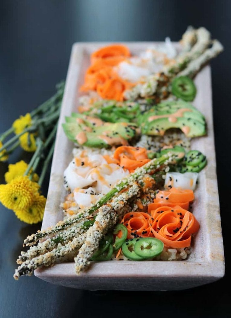 Sushi bowl with daikon radish and carrot ribbon, and panic crusted asparagus.