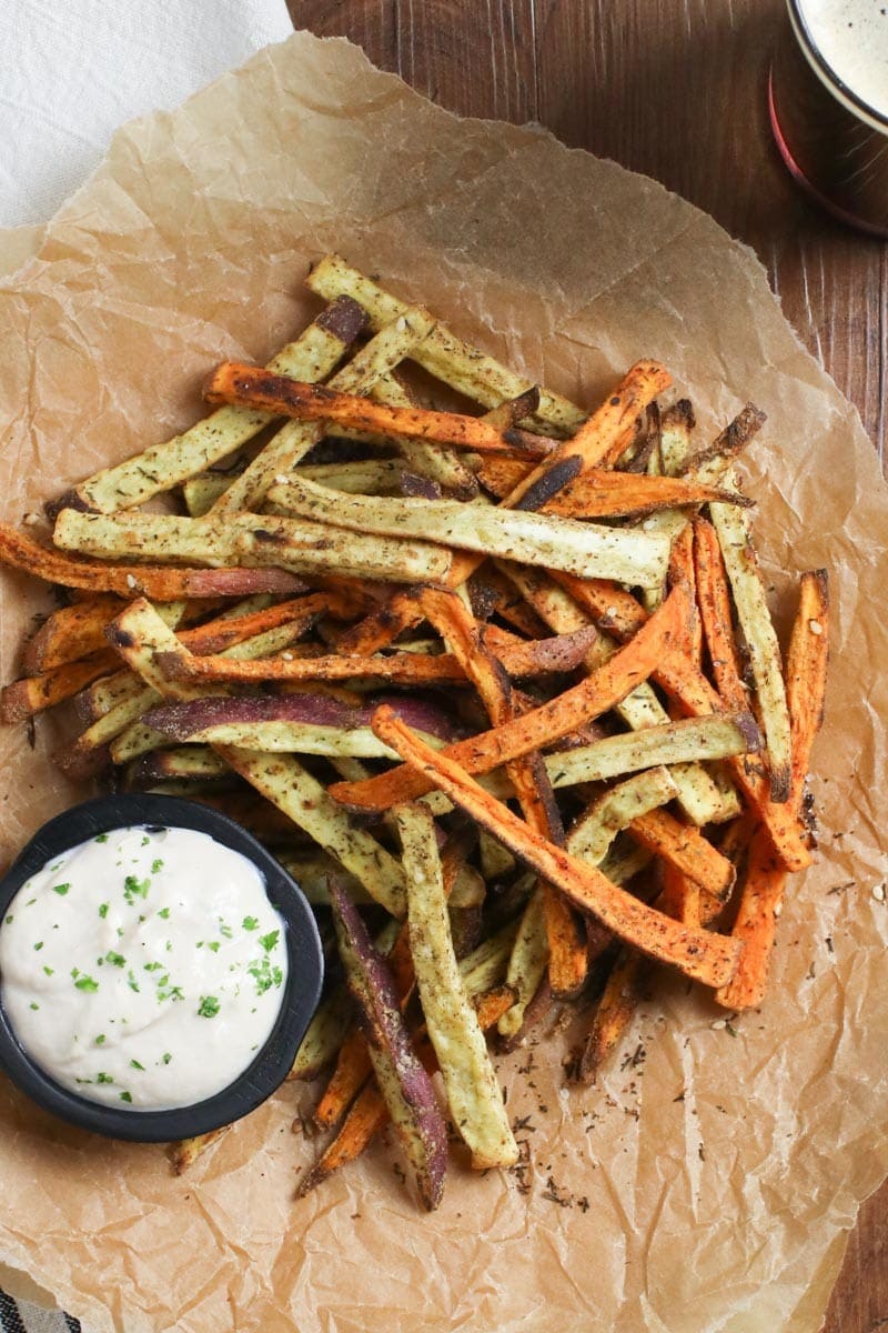 Baked Za’atar Sweet Potato Fries with Oil Free Aioli Sauce on brown craft paper
