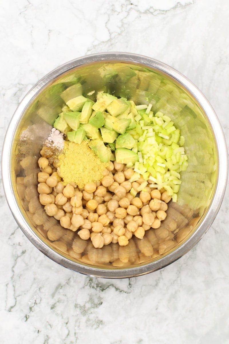 chickpeas, avocado, nutritional yeast, diced celery in a bowl