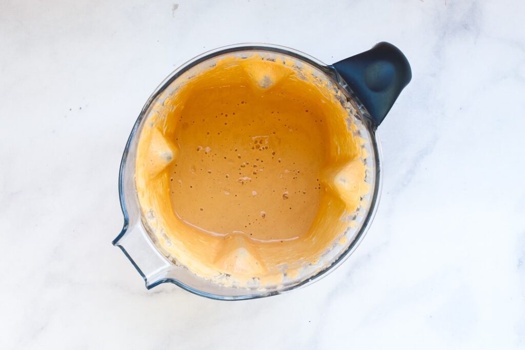 Cheese Sauce Blender Blender with finished cashew cheese sauce.