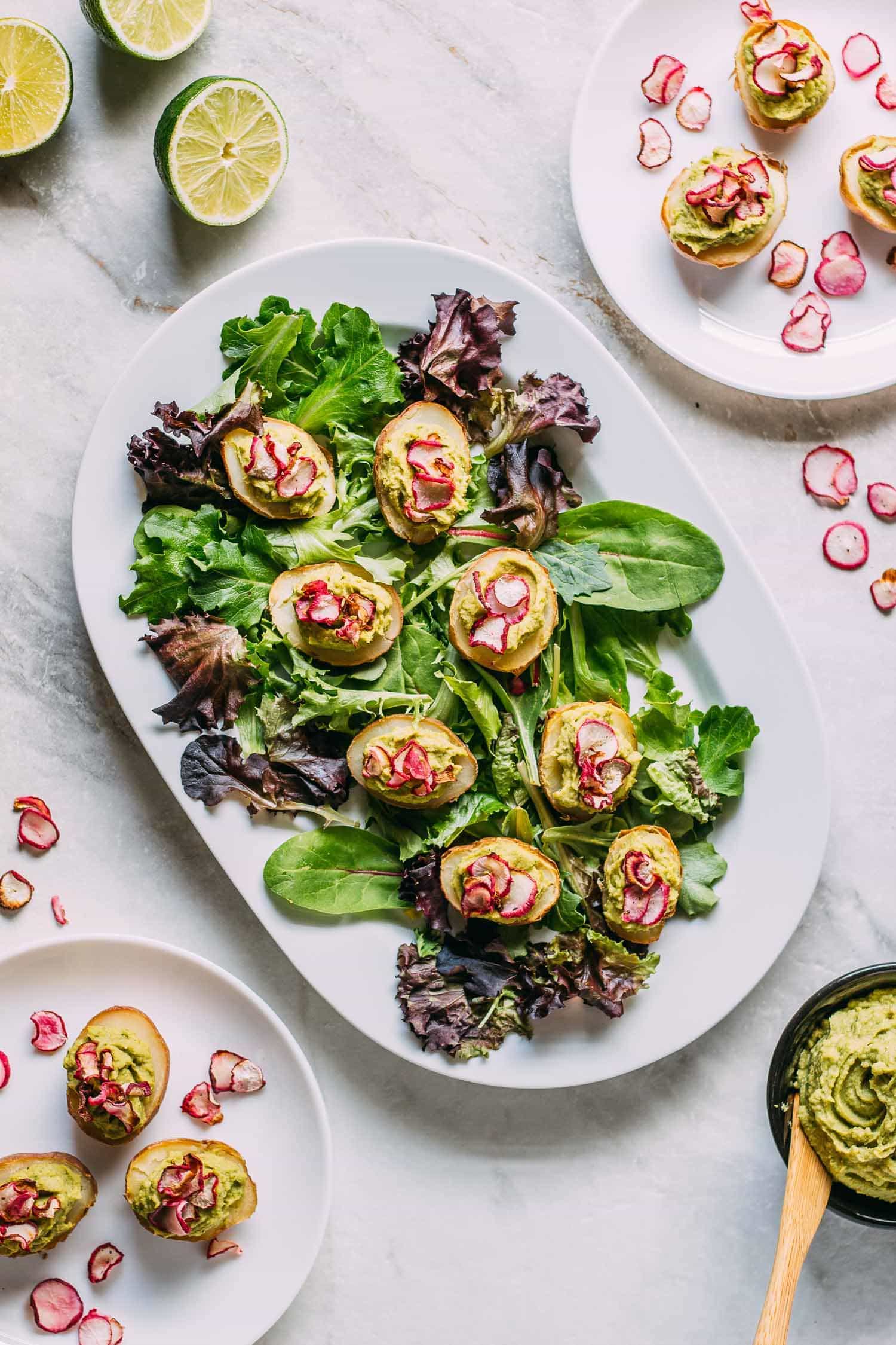 Potato Avocado Hummus & Radish Chip Appetizers on white platter