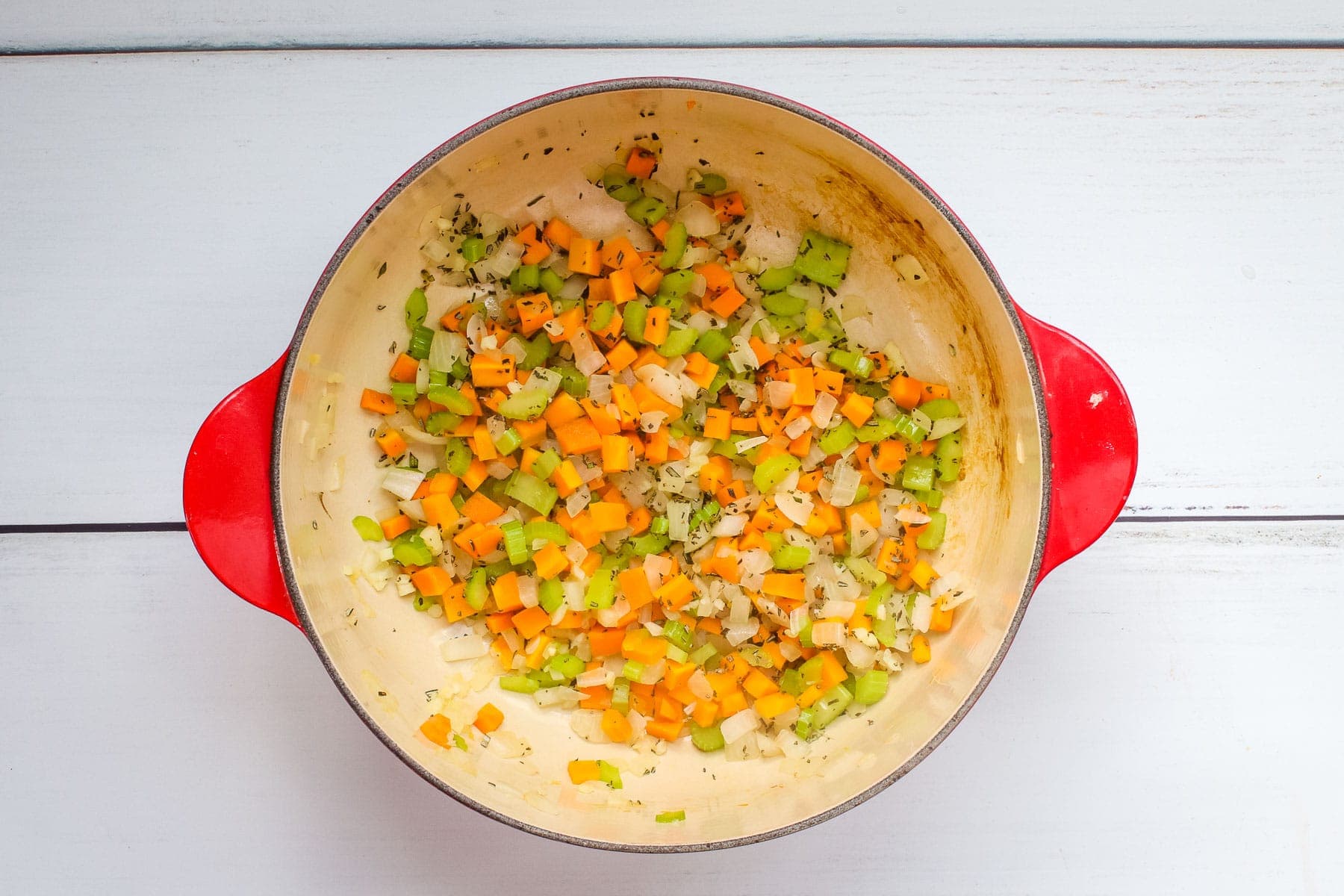 Saute onion, celery, carrots and garlic in a Dutch oven or large pot.