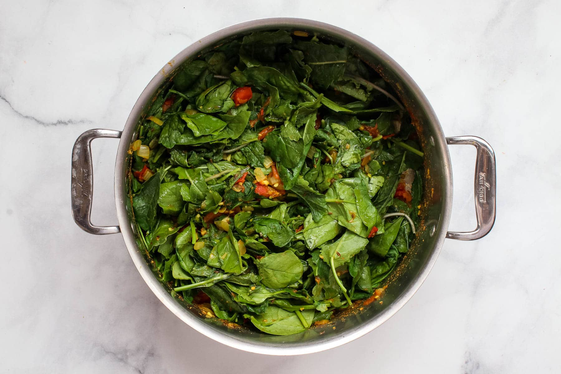 Pot of wilting spinach.