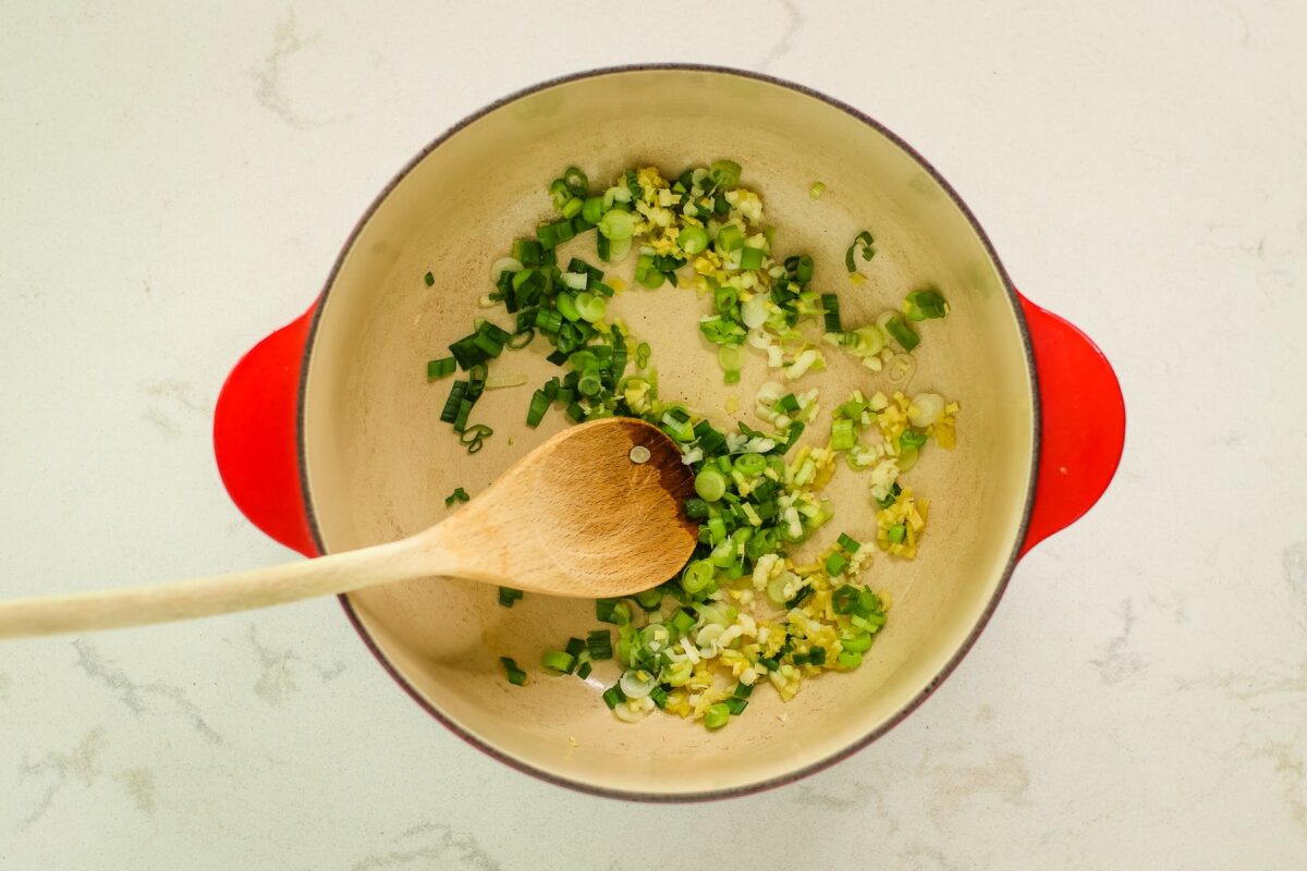 red pot with sautéed aromatics