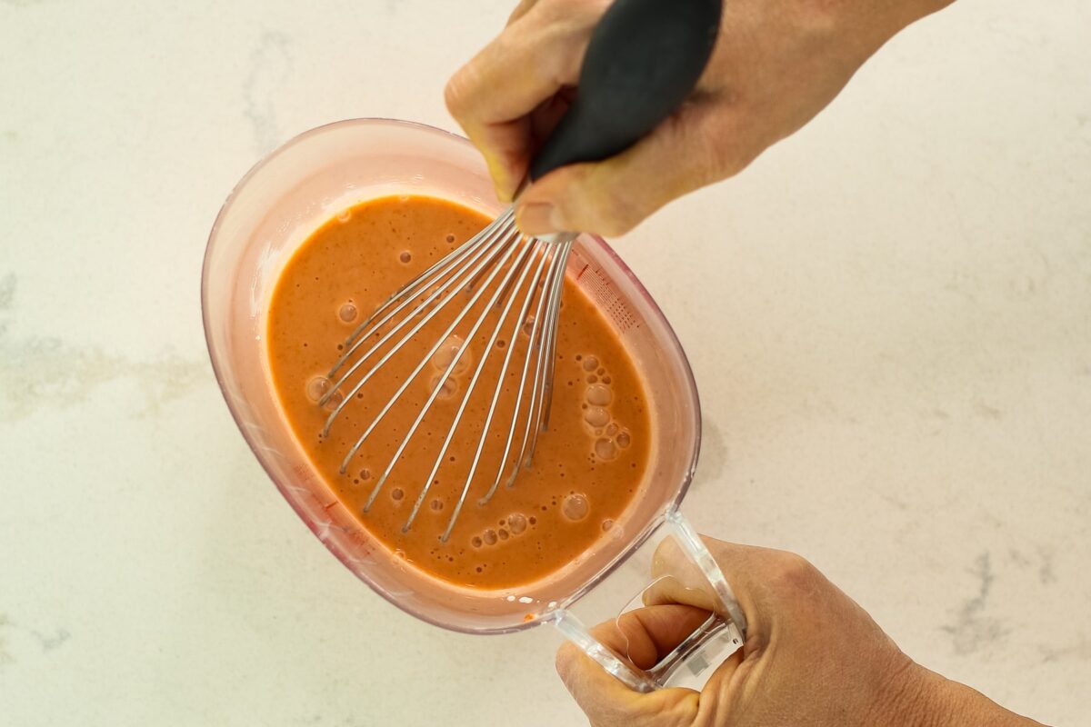 whisking in a measuring cup