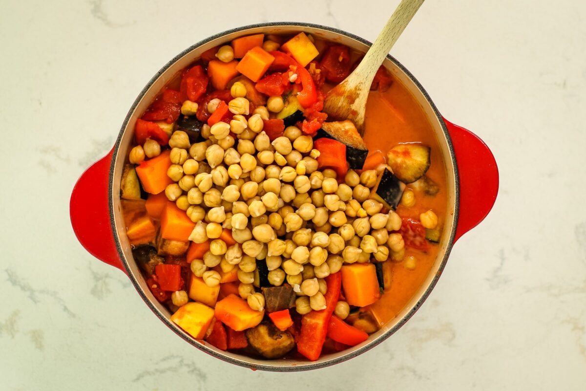 veggies, chickpeas and coconut milk mixture in pot