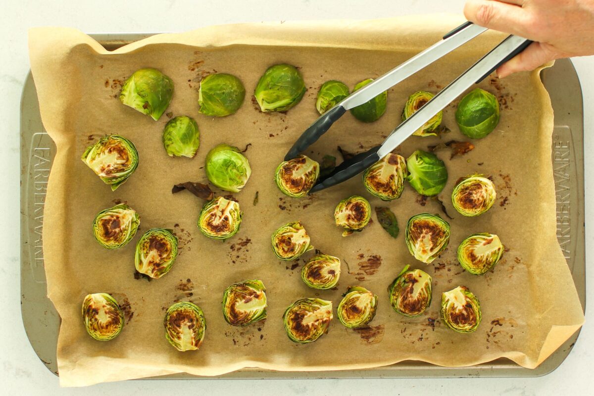 roasted Brussels sprouts on sheet pan, face side up.