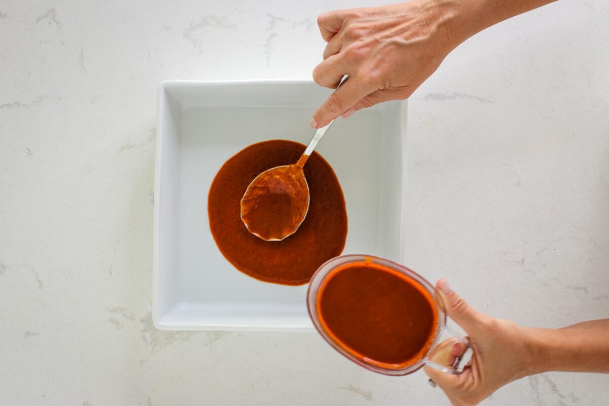 baking dish with enchilada sauce 