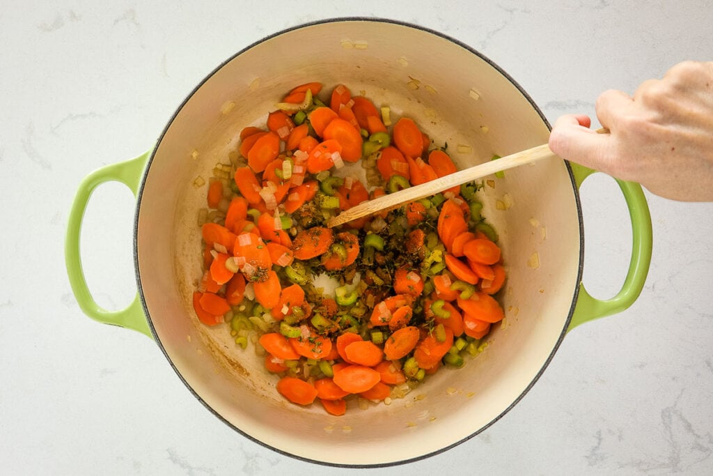 Carrots, celery, and other veggies stirred together with herbs and spices.
