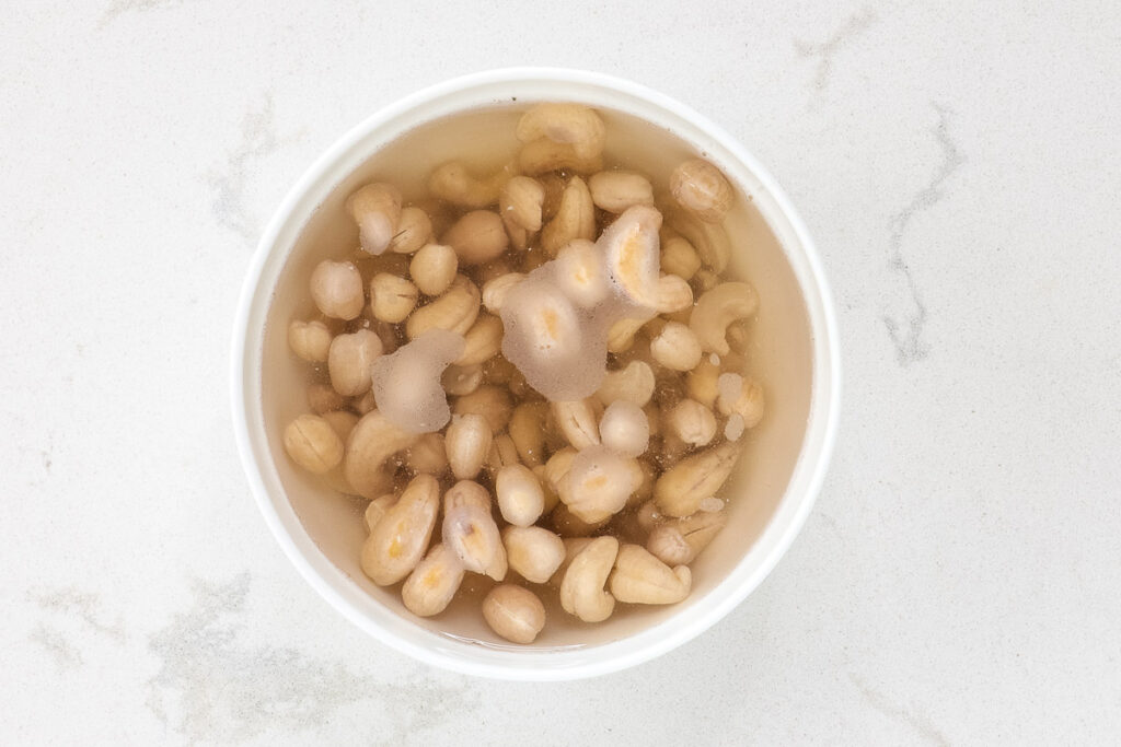 Cashews soaking in a bowl.