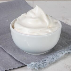 Close up bowl of aquafaba whipped cream.