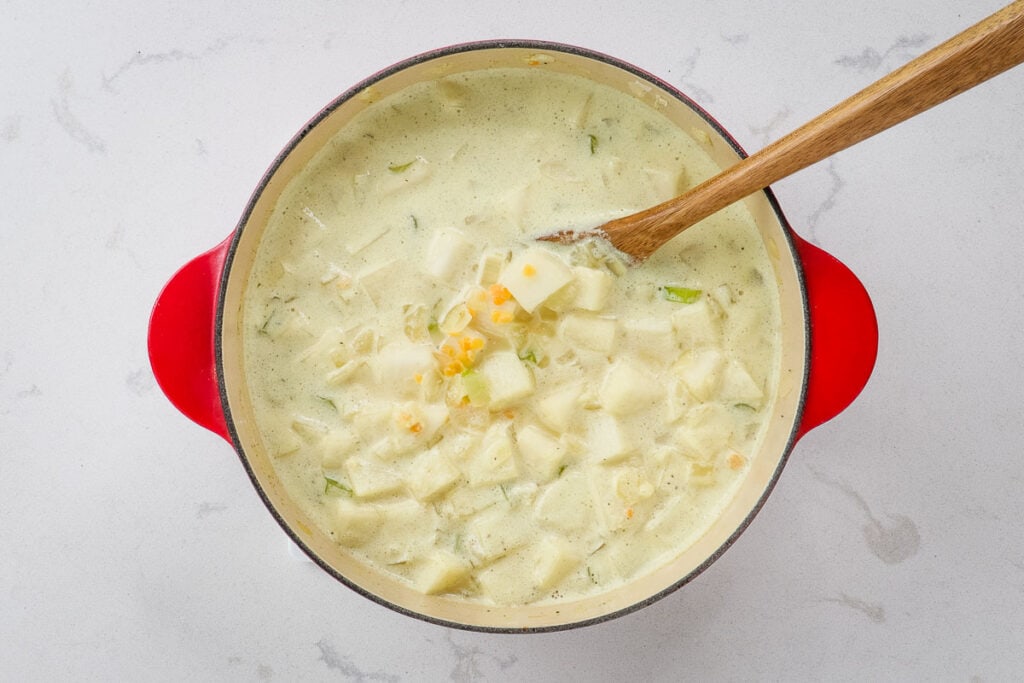 Simmering chowder in a Dutch oven.